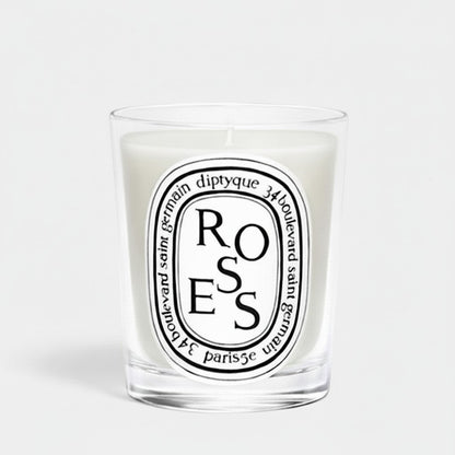 Shop Rescue Spa Diptyque Roses scented candle in a clear glass vessel with a signature oval label