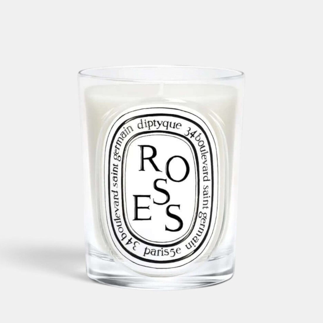 Shop Rescue Spa Diptyque Roses scented candle in a clear glass vessel with a signature oval label