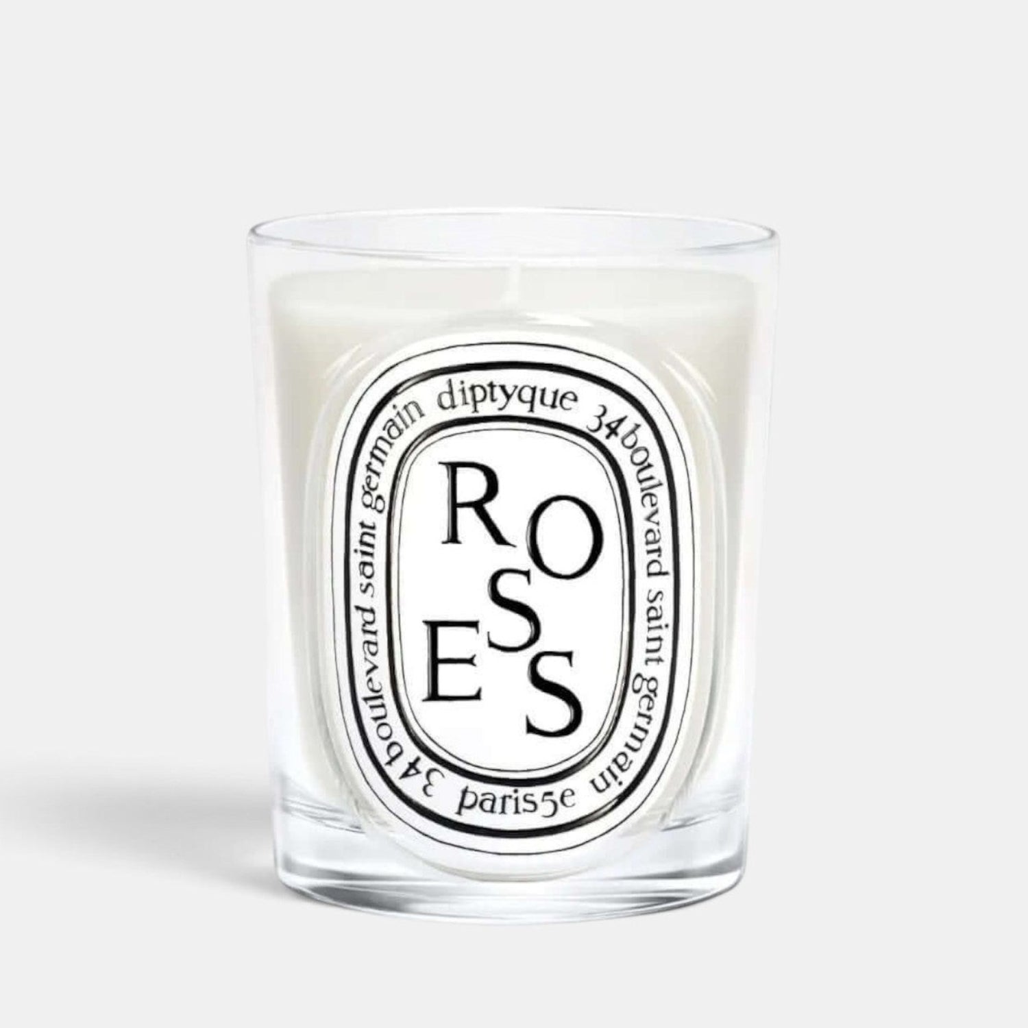 Shop Rescue Spa Diptyque Roses scented candle in a clear glass vessel with a signature oval label