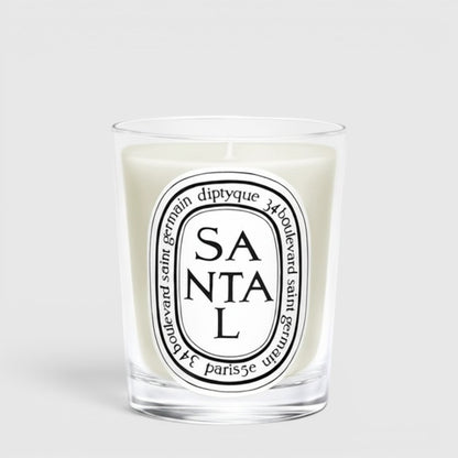 Shop Rescue Spa Diptyque Santal scented candle in a clear glass vessel with a signature oval label.