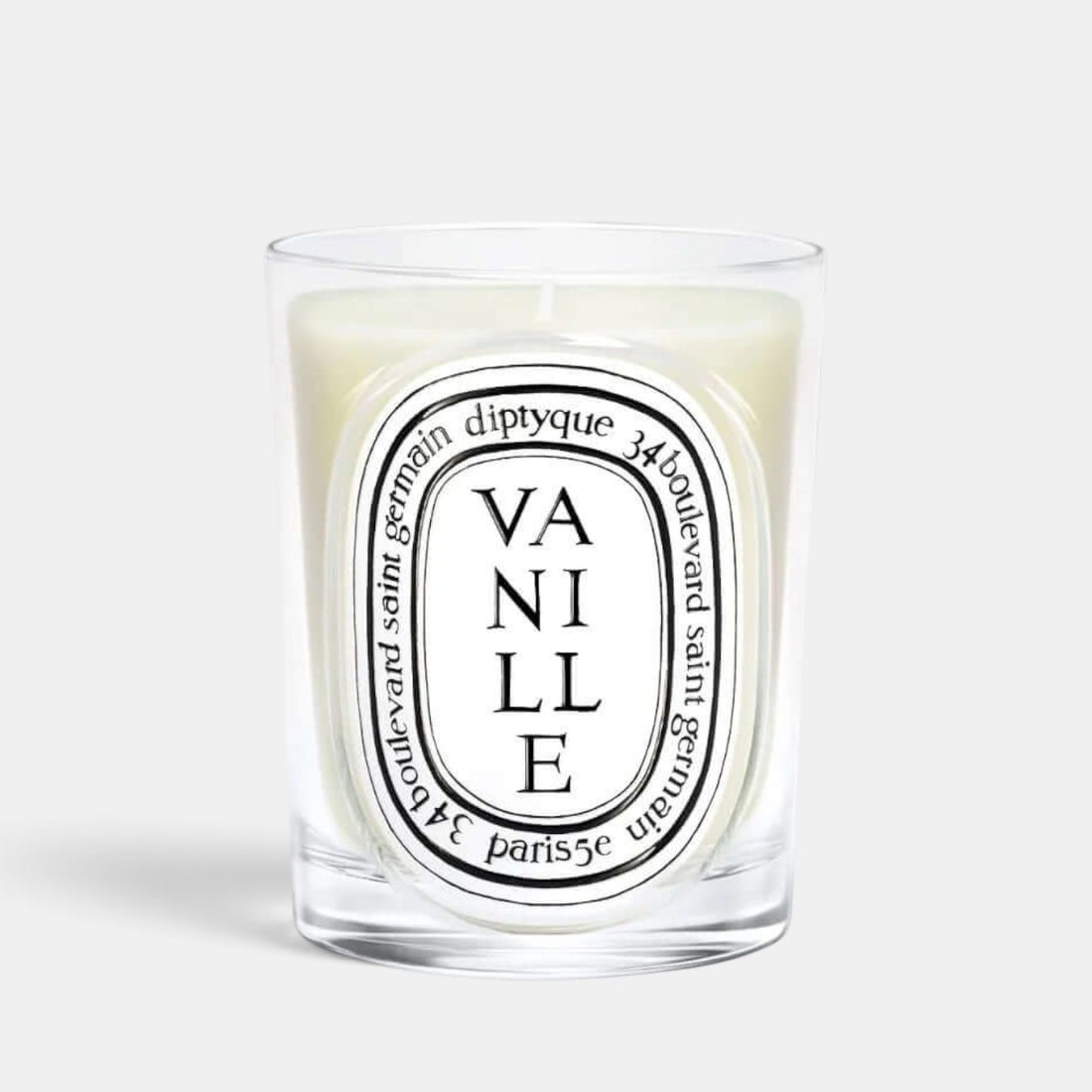 Shop Rescue Spa Diptyque Vanille scented candle in a clear glass vessel with signature black and white label