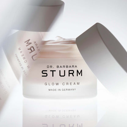Shop Rescue Spa Dr. Barbara Sturm Glow Cream in a frosted glass jar with a white lid, showing rich moisturizing cream.