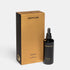 Shop Rescue Spa Eighth Day The Regenerative Serum in a black glass dropper bottle next to its gold and black box.