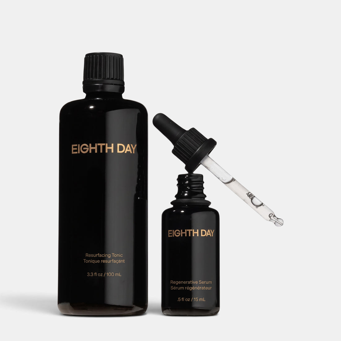 Shop Rescue Spa Eighth Day Performance Duo set with black resurfacing tonic bottle and regenerative serum dropper.