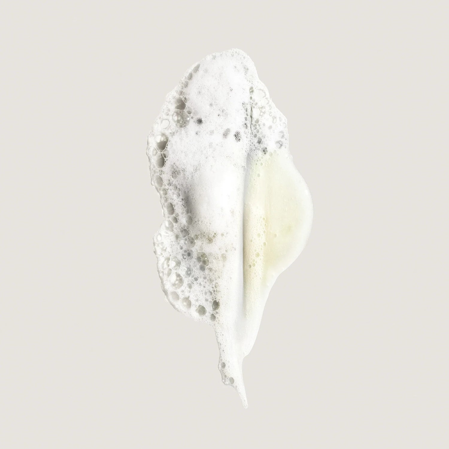 Shop Rescue Spa Eternal Curls Moisturizing Shampoo foam swatch with white bubbles and a hint of yellow