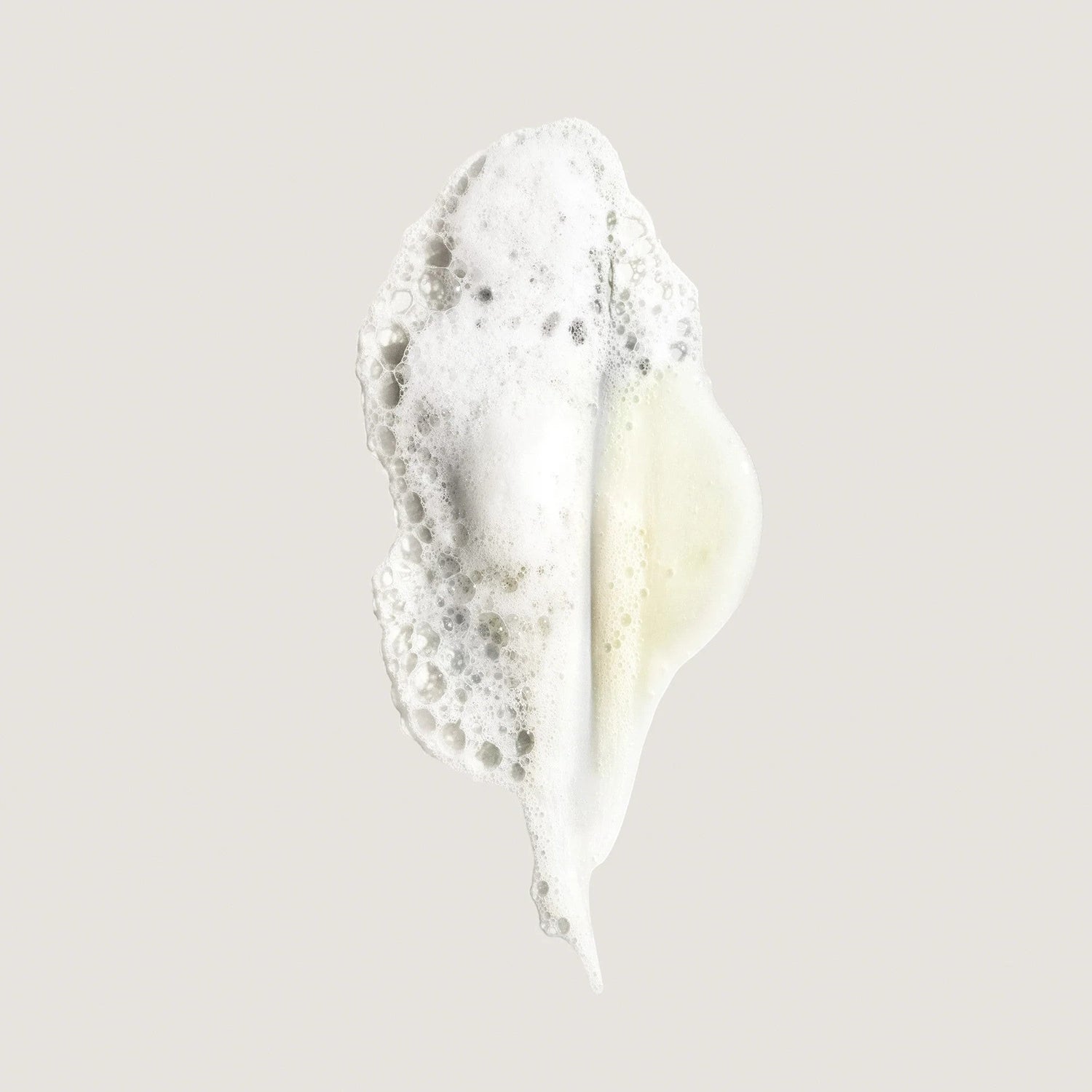 Shop Rescue Spa Eternal Curls Moisturizing Shampoo foam swatch with white bubbles and a hint of yellow