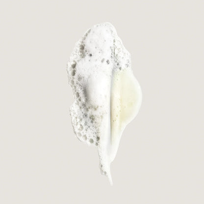 Shop Rescue Spa Eternal Curls Moisturizing Shampoo foam swatch with white bubbles and a hint of yellow
