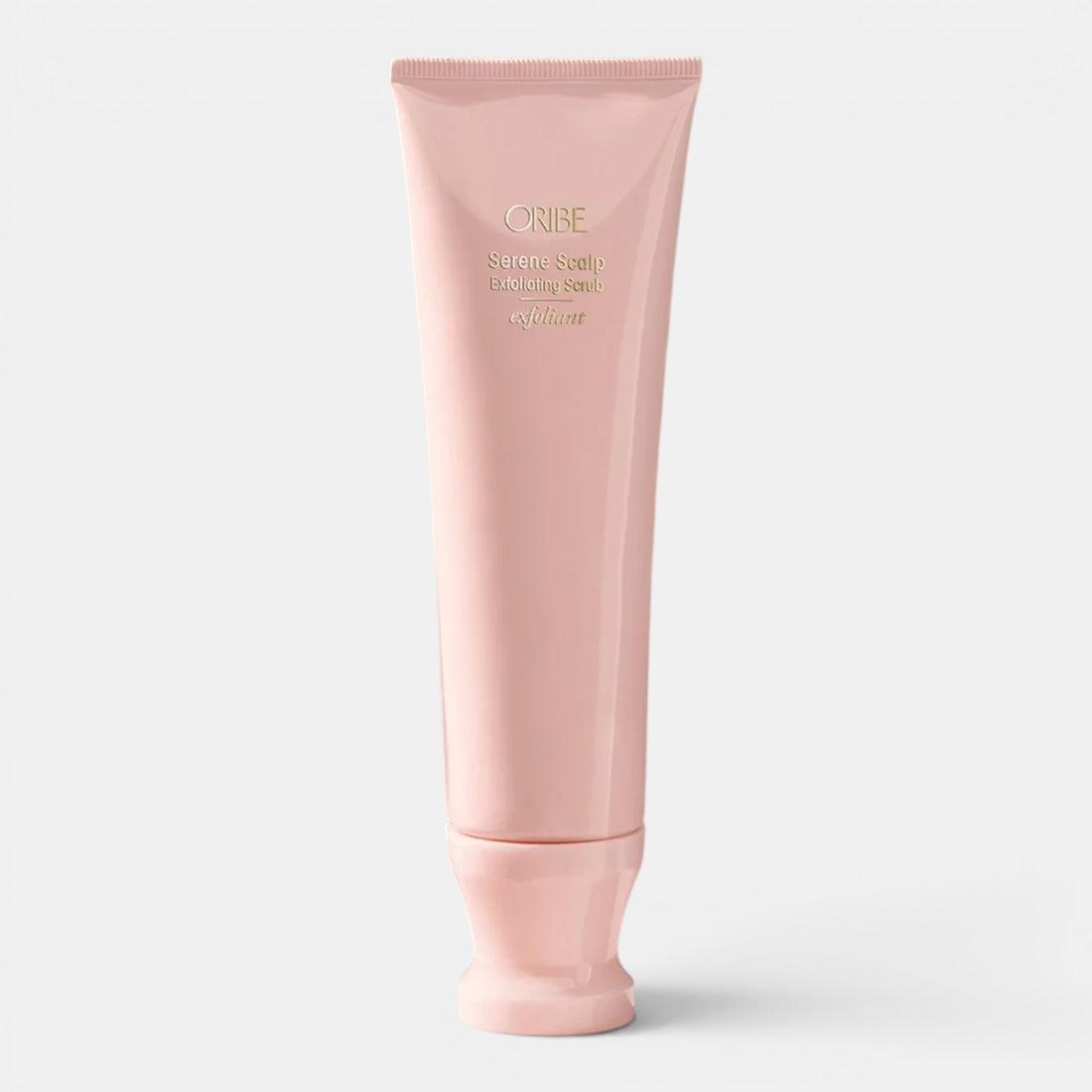 Shop Rescue Spa Oribe Serene Scalp Exfoliating Scrub in a light pink tube, gently polishes scalp with exfoliating beads.