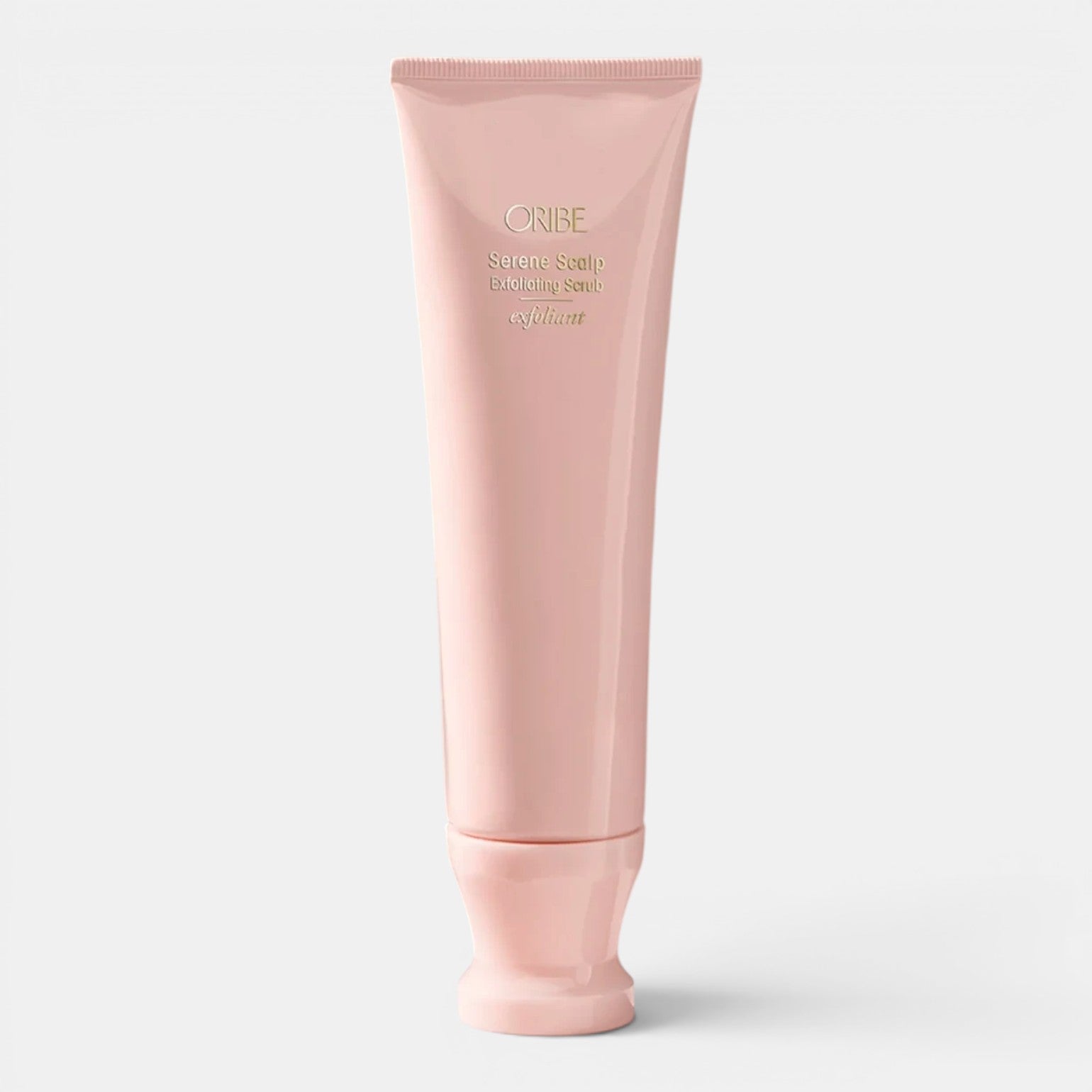 Shop Rescue Spa Oribe Serene Scalp Exfoliating Scrub in a light pink tube, gently polishes scalp with exfoliating beads.