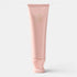 Shop Rescue Spa Oribe Serene Scalp Exfoliating Scrub in a light pink tube, gently polishes scalp with exfoliating beads.