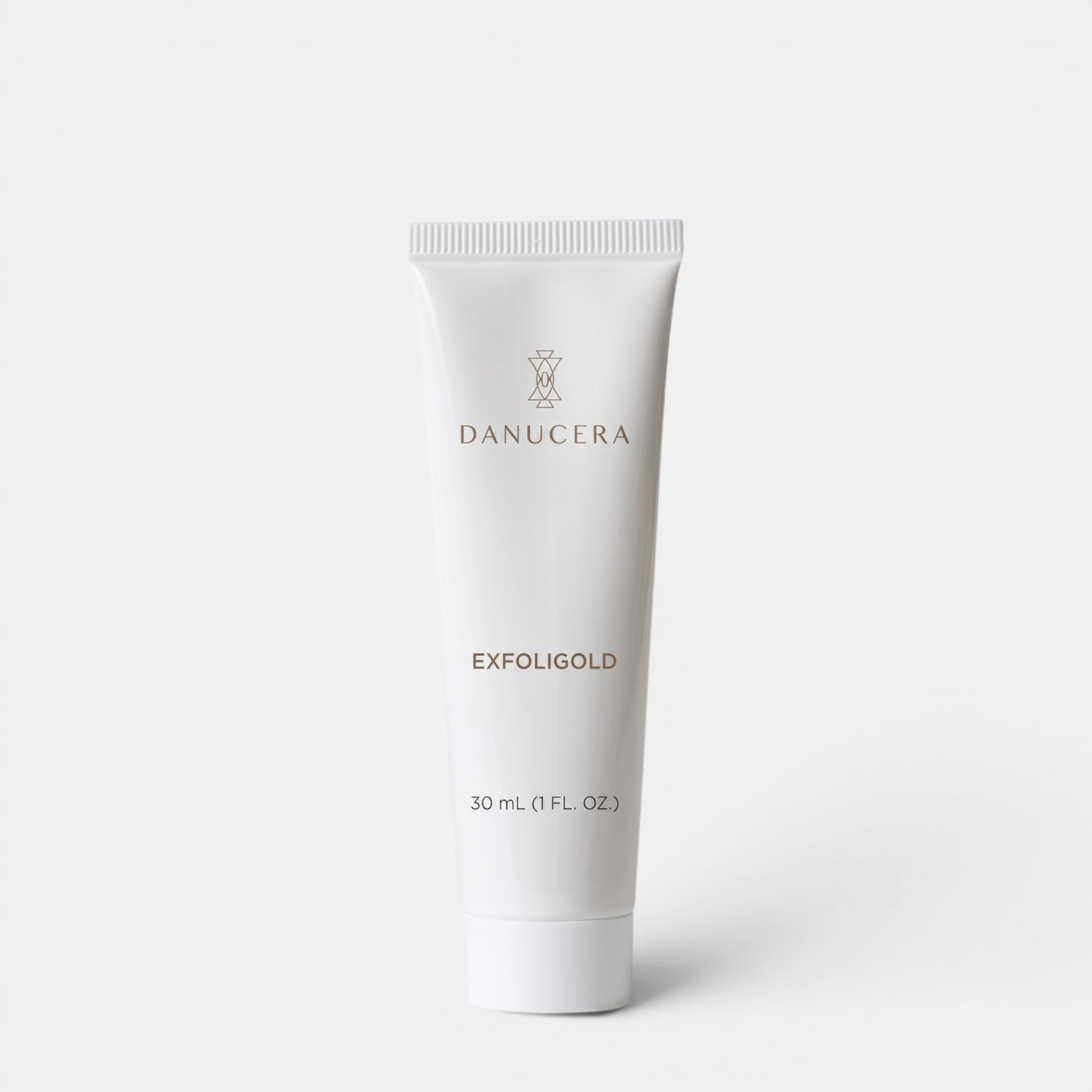 Shop Rescue Spa Exfoligold non-abrasive facial scrub in a 30ml white squeeze tube against a plain background.