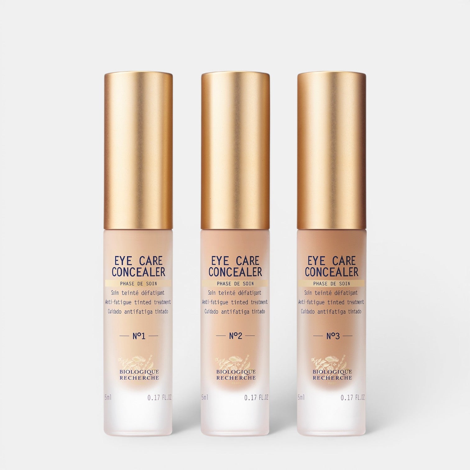 Shop Rescue Spa Eye Care Concealer in three shades with gold caps for brightening and smoothing tired eyes.