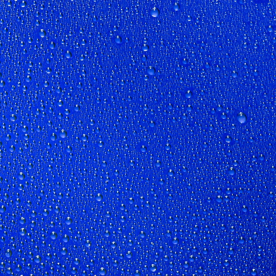 Shop Rescue Spa The Face Mist hydrating spray droplets on a vibrant blue background representing refreshing moisture