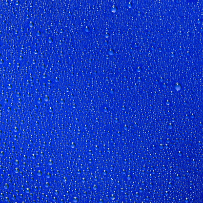 Shop Rescue Spa The Face Mist hydrating spray droplets on a vibrant blue background representing refreshing moisture