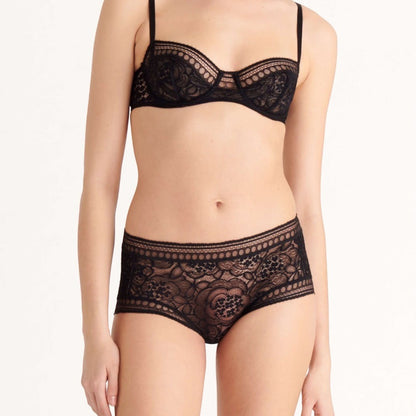 Shop Rescue Spa Facettes black demi-cup bra featuring delicate floral lace patchwork and graphic trim details.
