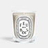 Shop Rescue Spa Diptyque Feu de Bois scented candle in a clear glass vessel with a beige wax finish