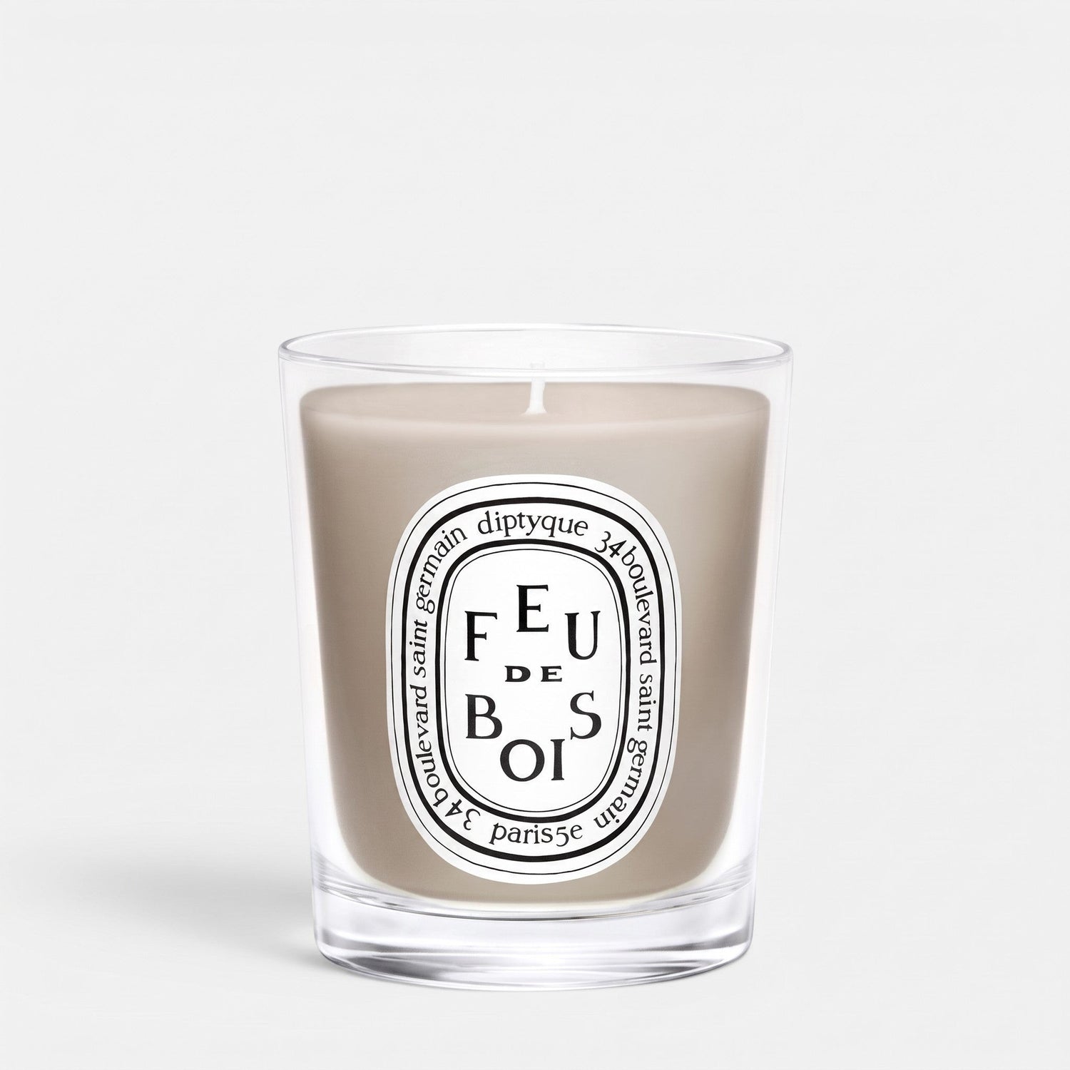 Shop Rescue Spa Feu De Bois scented candle in a clear glass jar with a signature oval label and smoky wax