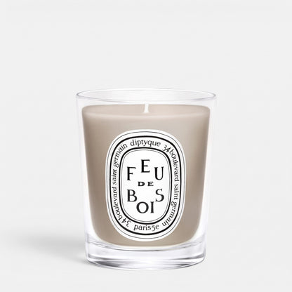 Shop Rescue Spa Feu De Bois scented candle in a clear glass jar with a signature oval label and smoky wax