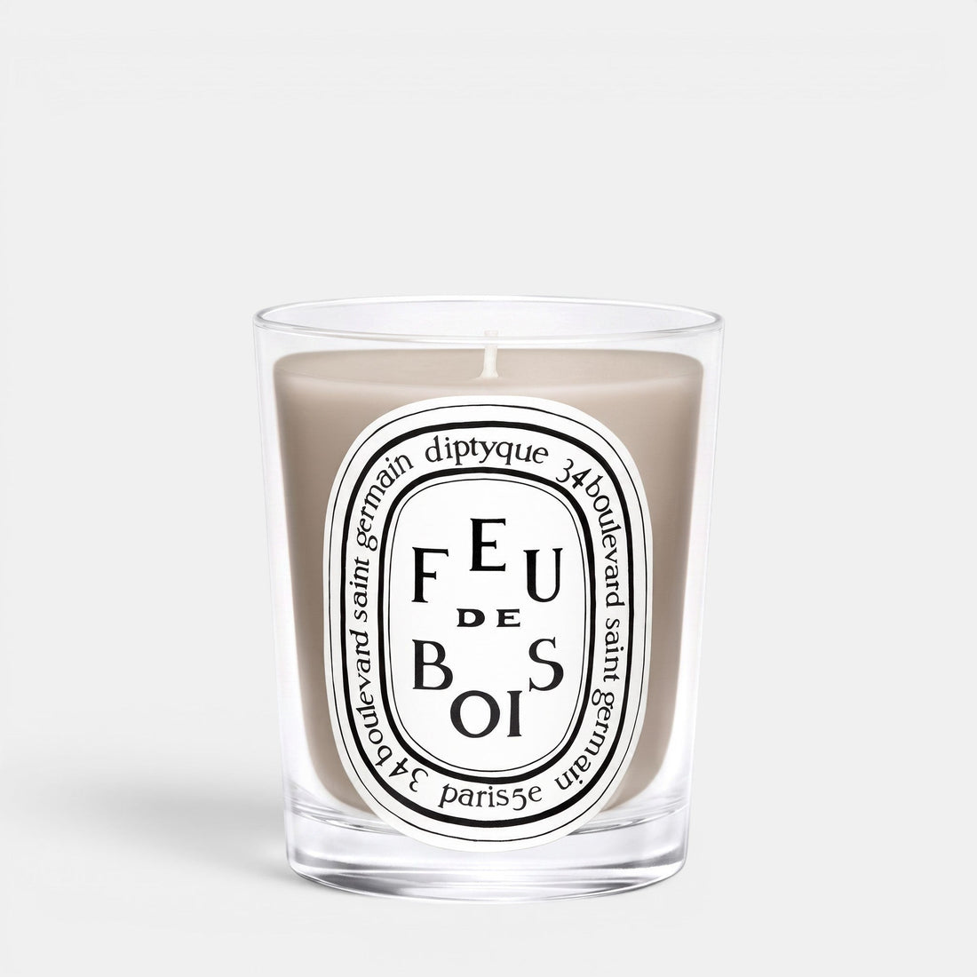 Shop Rescue Spa Feu De Bois scented candle in a clear glass jar with a smoky wood fragrance and iconic label