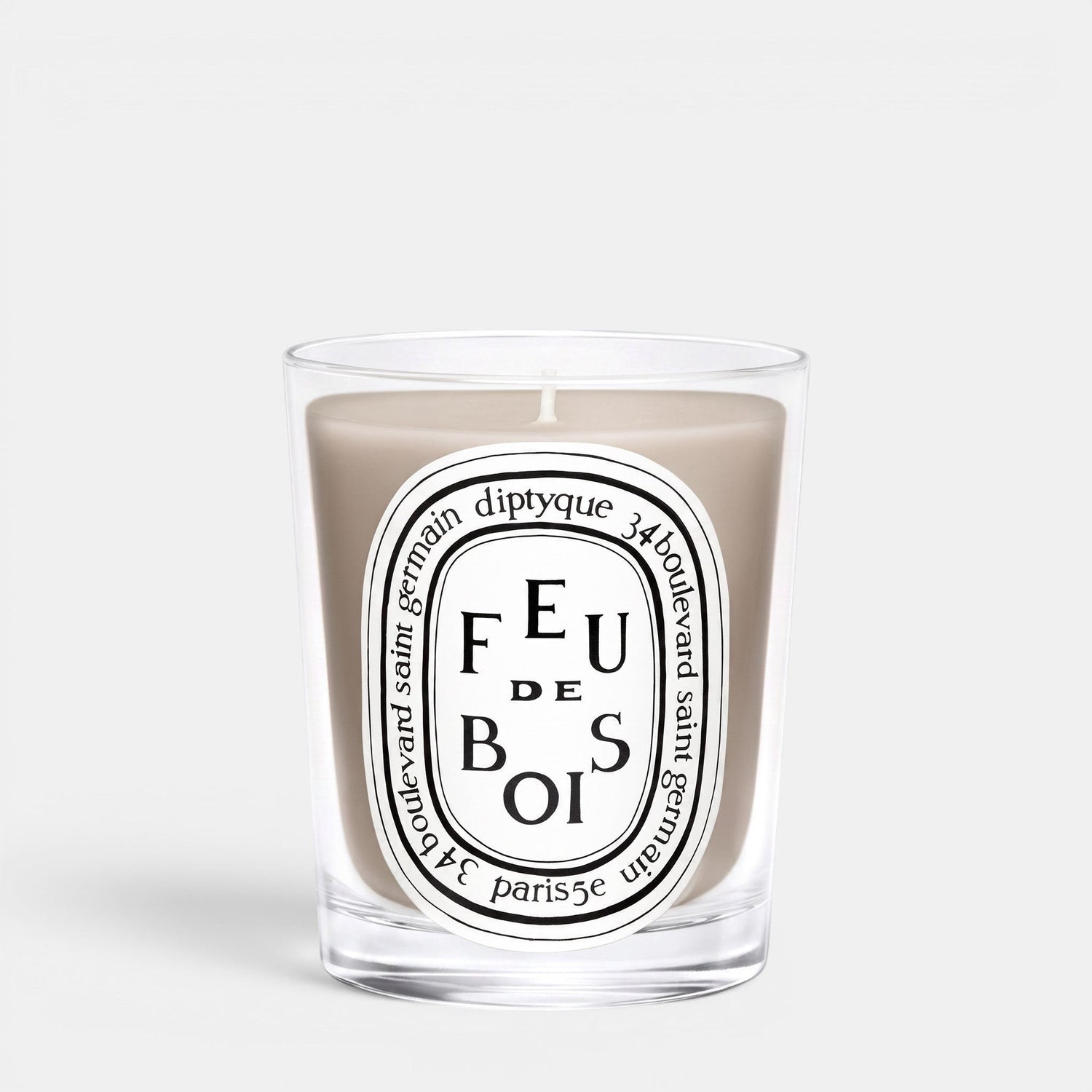 Shop Rescue Spa Feu De Bois scented candle in a clear glass jar with a smoky wood fragrance and iconic label