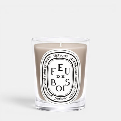 Shop Rescue Spa Feu De Bois scented candle in a clear glass jar with a smoky wood fragrance and iconic label