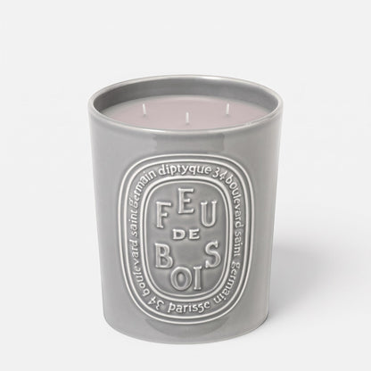 Shop Rescue Spa Feu De Bois scented candle in a grey ceramic vessel with embossed branding