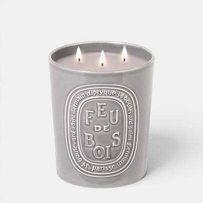 Shop Rescue Spa Feu De Bois three-wick candle in a grey ceramic vessel with a smoky wood fire scent