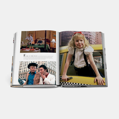 Shop Rescue Spa Fifth Avenue book open to pages featuring film stills and a young girl leaning out of a yellow taxi