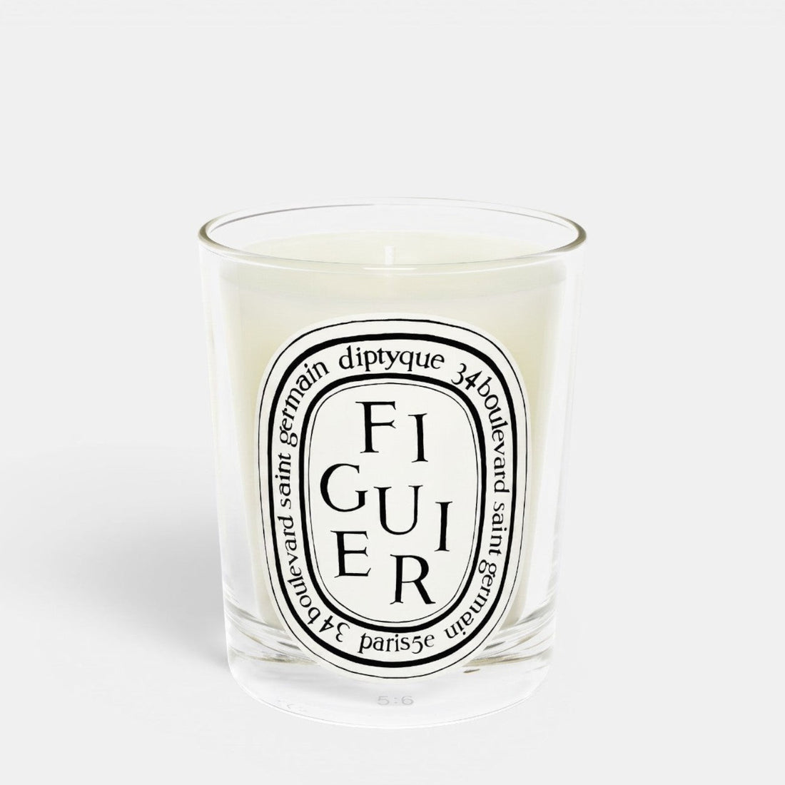 Shop Rescue Spa Figuier fig tree scented candle in a clear glass jar with a signature oval label