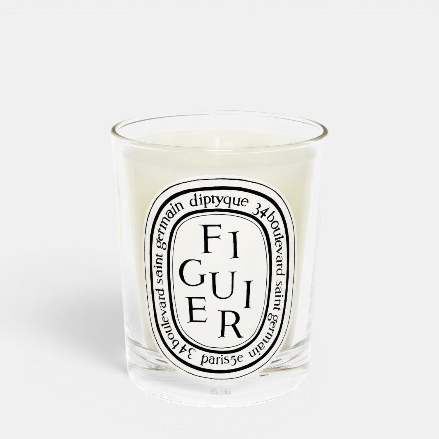 Shop Rescue Spa Figuier fig tree scented candle in a clear glass jar with a signature oval label