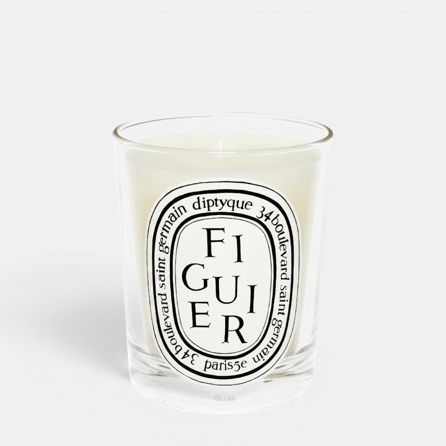 Shop Rescue Spa Figuier fig tree scented candle in a clear glass jar with a signature oval label