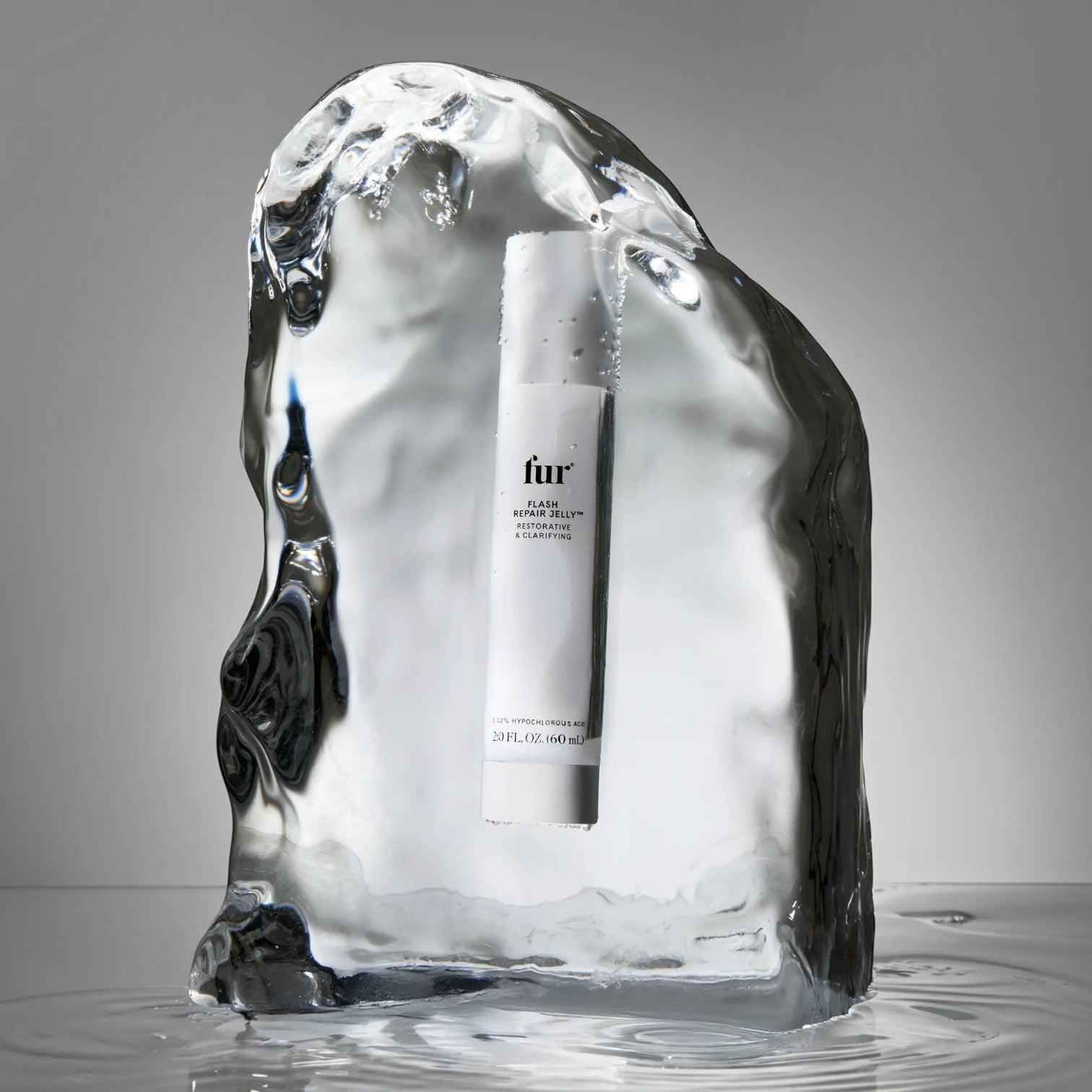 Shop Rescue Spa Flash Repair Jelly bottle encased in a block of clear ice, highlighting its cooling, soothing formula.