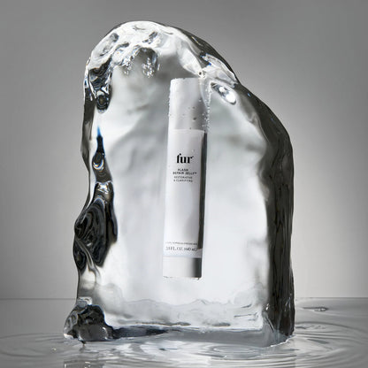 Shop Rescue Spa Flash Repair Jelly bottle encased in a block of clear ice, highlighting its cooling, soothing formula.
