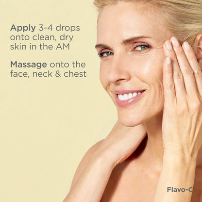 Shop Rescue Spa Flavo-C Serum applied by a smiling woman to her face for radiant and youthful skin