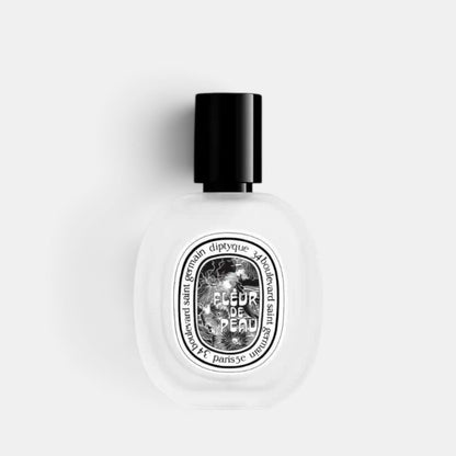 Shop Rescue Spa Fleur De Peau hair mist in a frosted glass bottle with a black cap and iconic oval label