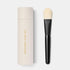 Shop Rescue Spa Westman Atelier foundation brush with a black lacquered handle and matching cylindrical storage case.