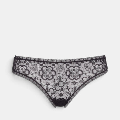 Shop Rescue Spa FRIVOLE black lace tanga with floral pattern and detailed trim on waistband and thighs