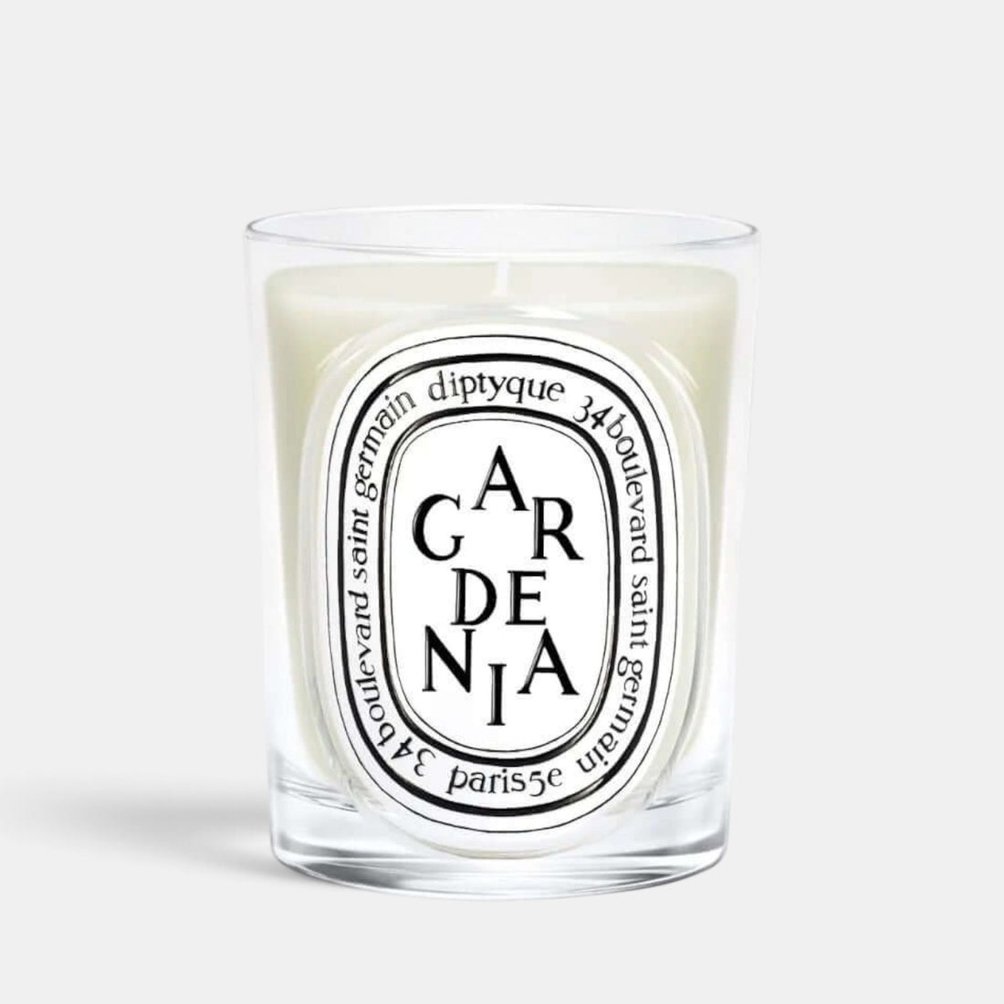 Shop Rescue Spa Gardenia scented candle in a clear glass vessel with a white wax blend and elegant black label