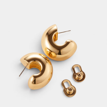 Shop Rescue Spa Gemma chunky gold hoop earrings with high-polish finish and supportive lobe lifter backings.