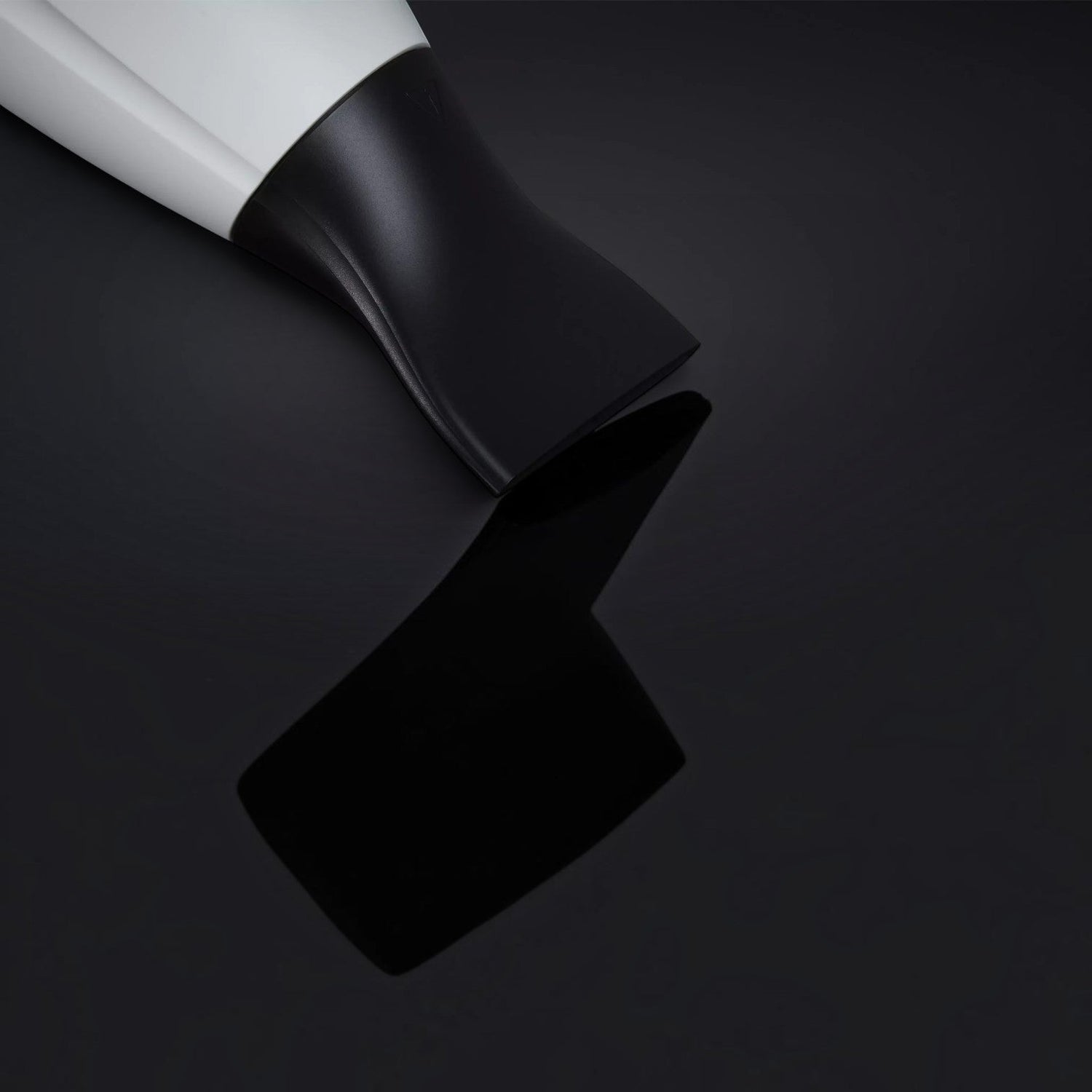 Shop Rescue Spa ghd helios professional hair dryer with a black contoured nozzle on a reflective black surface