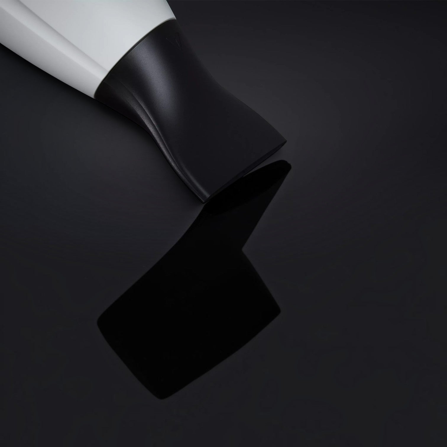 Shop Rescue Spa ghd helios professional hair dryer with a black contoured nozzle on a reflective black surface