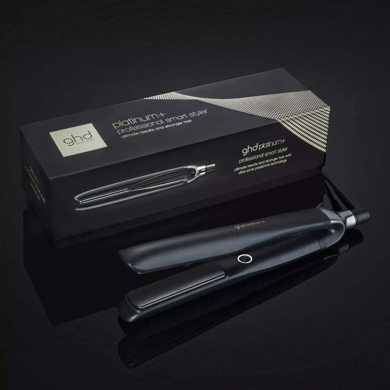 Shop Rescue Spa ghd Platinum+ smart flat iron with its black branded packaging box on a reflective dark surface
