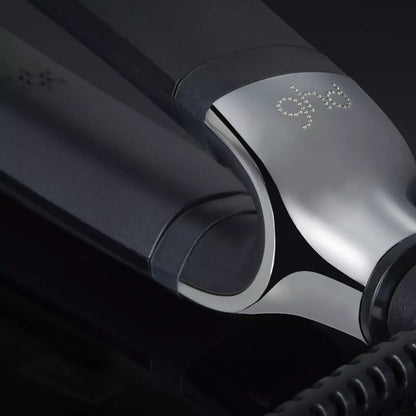 Shop Rescue Spa ghd Platinum+ Styler flat iron featuring a sleek black finish and metallic wishbone hinge detail.