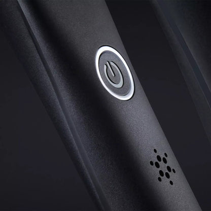 Close-up of the Shop Rescue Spa ghd Platinum+ Styler power button and indicator light on a matte black handle.