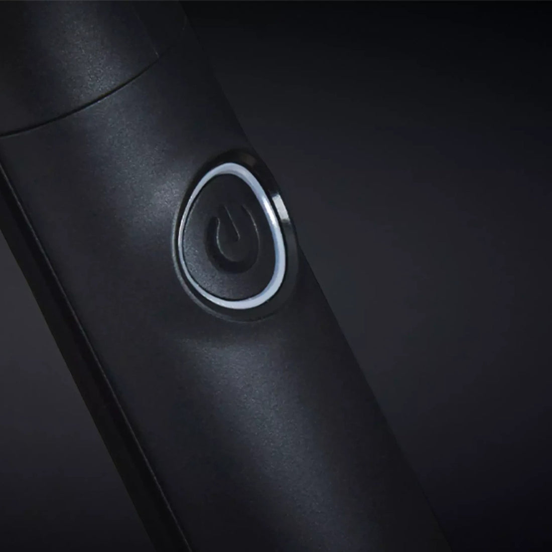 Shop Rescue Spa ghd rise volumizing hot brush power button detail on a sleek black handle