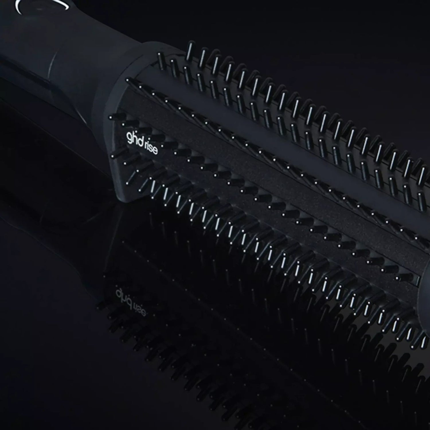 Shop Rescue Spa ghd rise volumizing hot brush with black barrel and nylon bristles for root lift on dark background