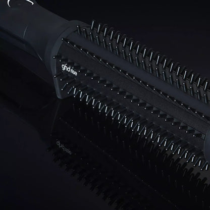 Shop Rescue Spa ghd rise volumizing hot brush with black barrel and nylon bristles for root lift on dark background