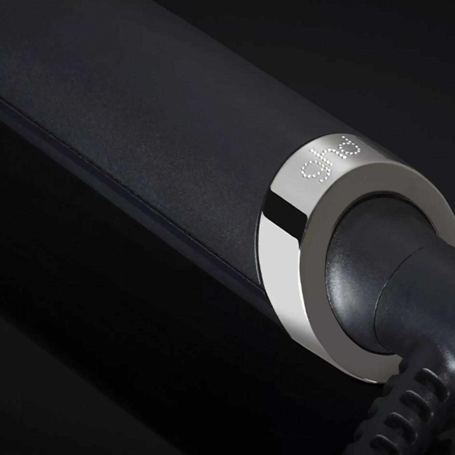 Shop Rescue Spa ghd rise volumizing hot brush featuring a sleek black handle and metallic silver accent detail