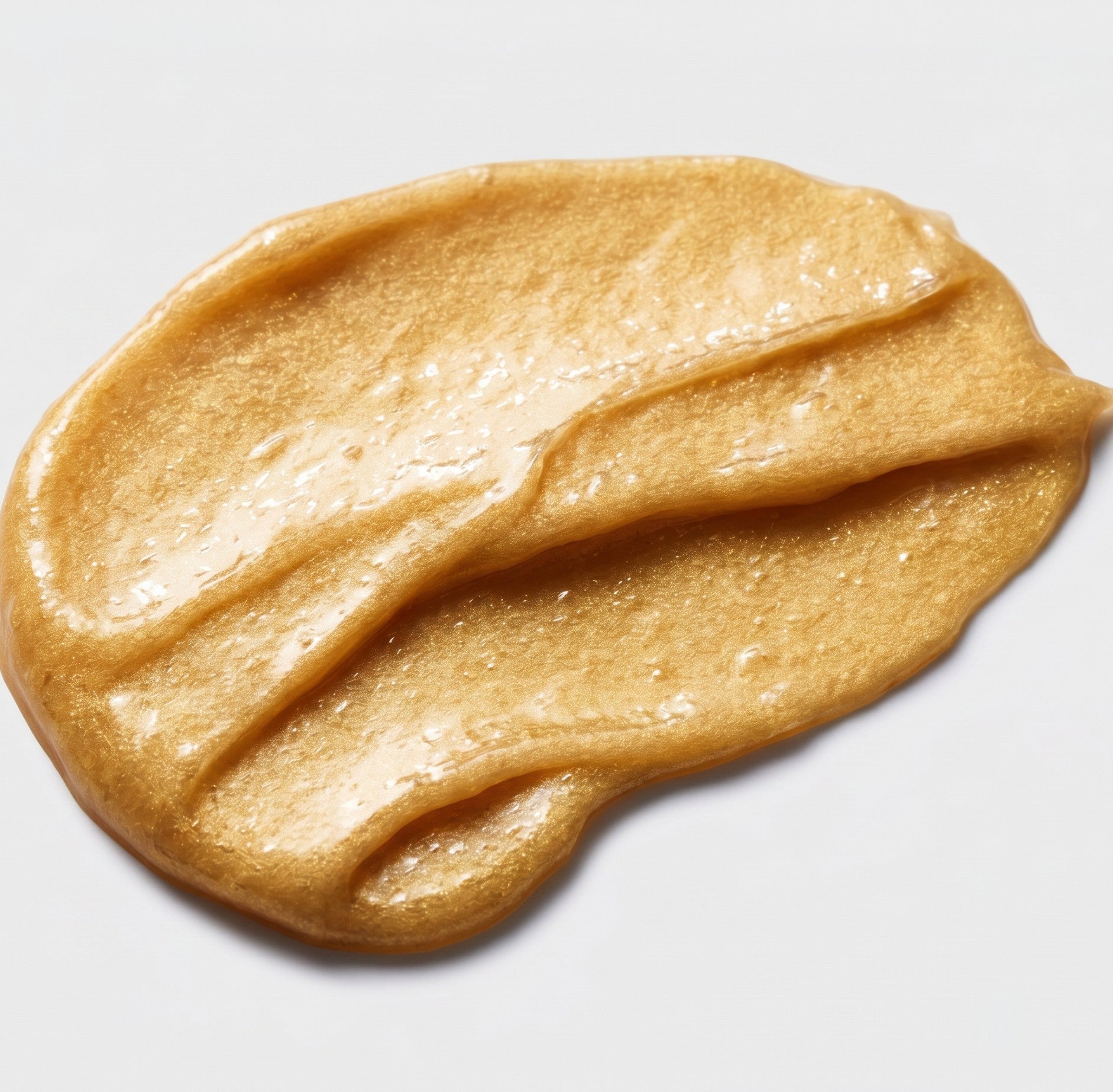 Shop Rescue Spa Sublime Gold Luminous Conditioner texture showing a shimmering gold hydrating hair balm smear