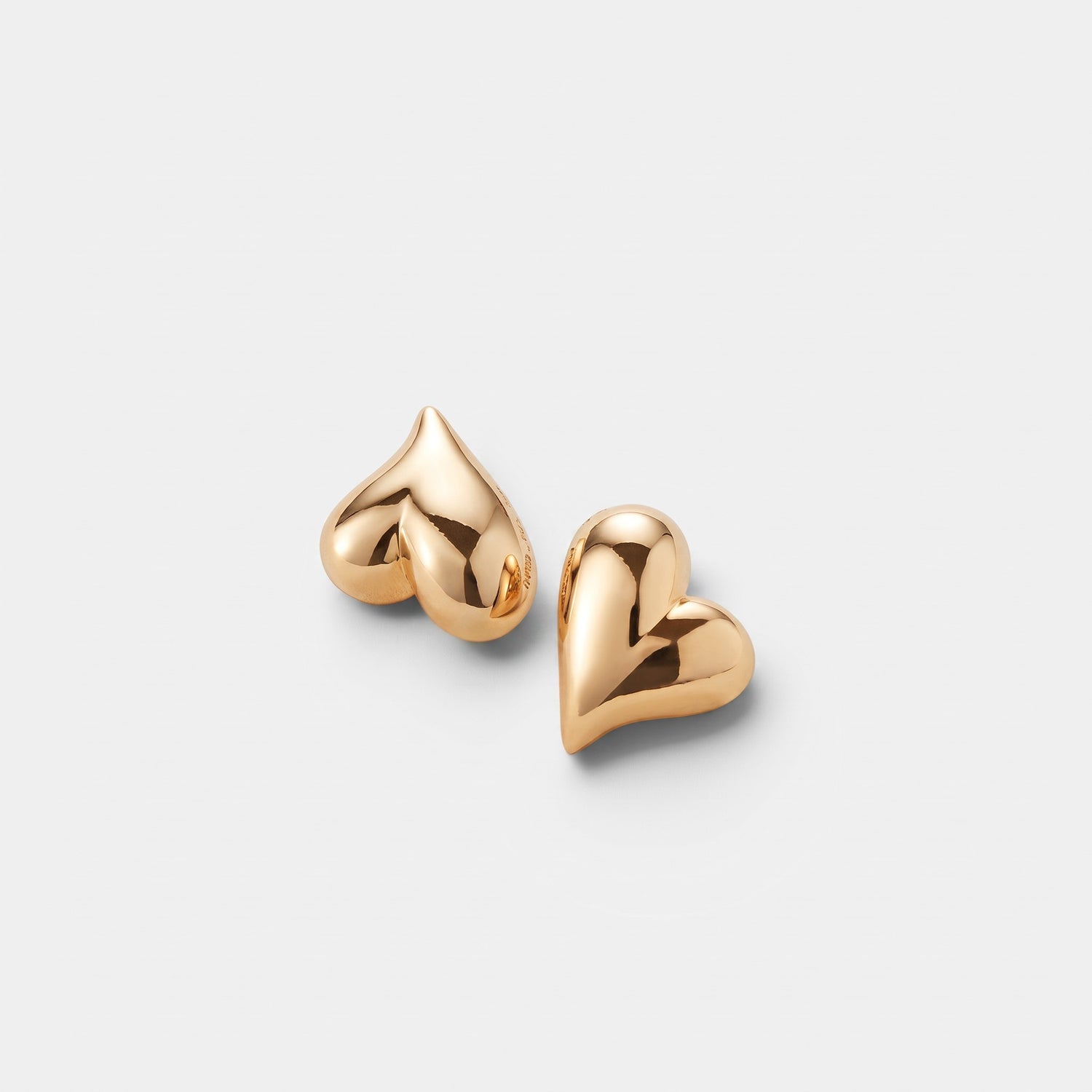 Shop Rescue Spa asymmetrical heart button earrings in high-polish 14k gold-dipped brass on a white background.